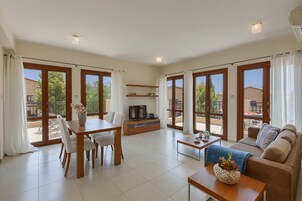 Apartment, 1 Bedroom | Living area | Flat-screen TV, DVD player