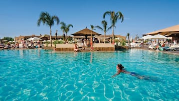 Indoor pool, outdoor pool, pool umbrellas, pool loungers