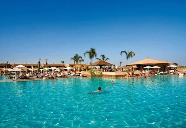 Indoor pool, outdoor pool, pool umbrellas, sun loungers