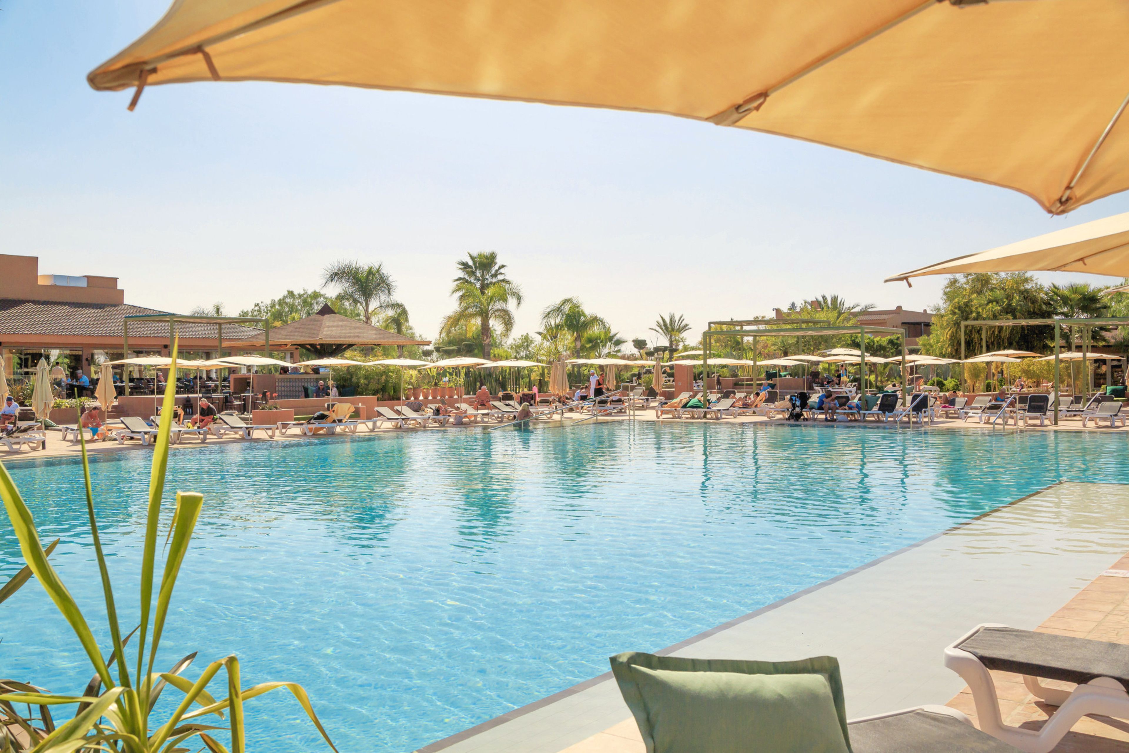 Indoor pool, outdoor pool, pool umbrellas, pool loungers