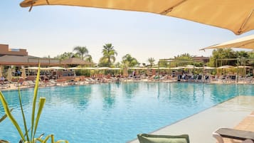 Indoor pool, outdoor pool, pool umbrellas, pool loungers