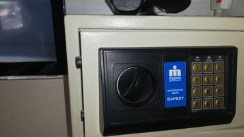 A safe with a digital keypad and a lock.