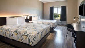 A hotel room with two beds, a desk, a chair, and a TV. - Motel 6 Fort Worth, TX – I-35 & I-20   (Fort Worth)