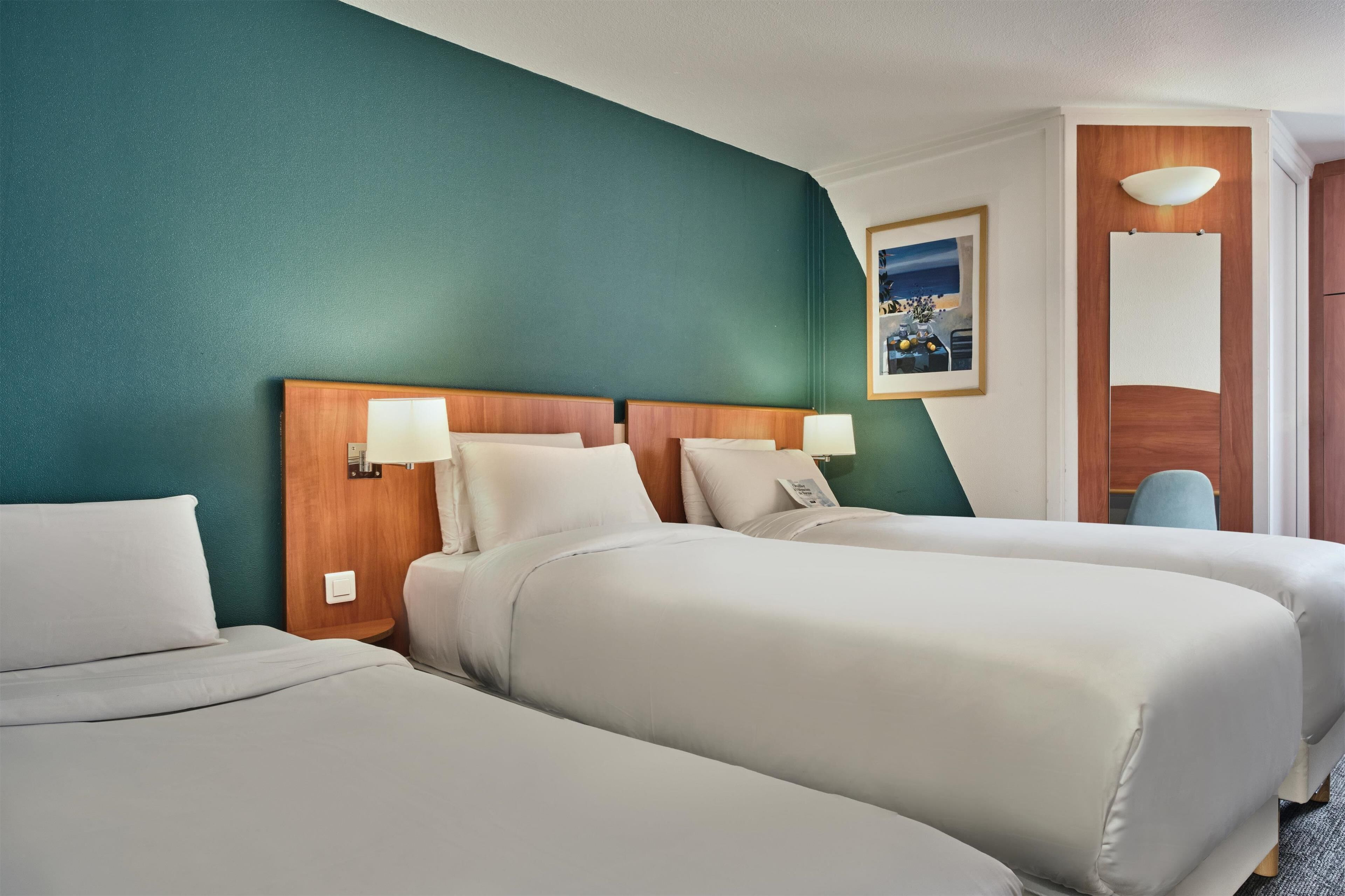 room, 3 single beds | in-room safe, desk, soundproofing, iron/ironing board