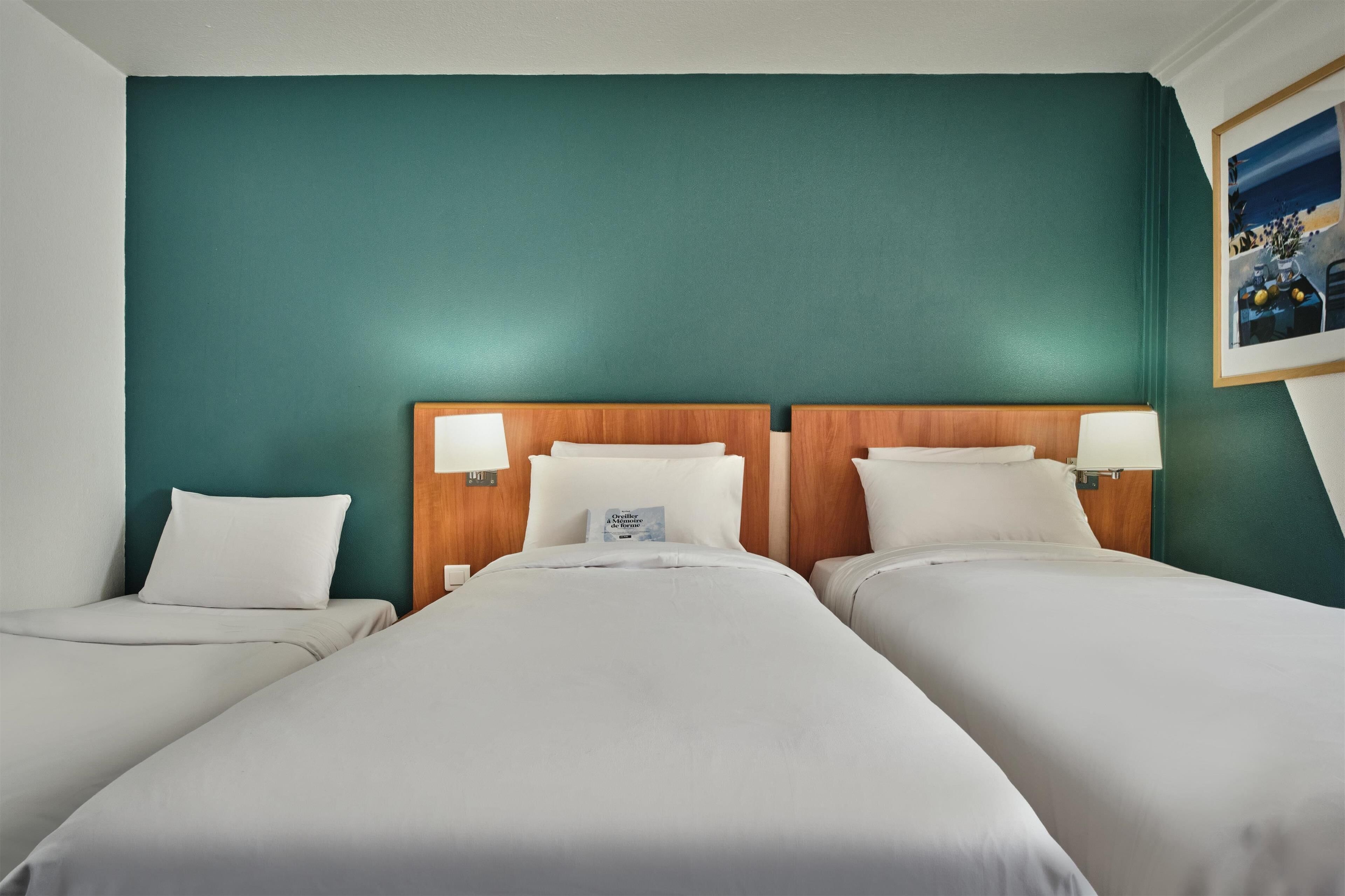 room, 3 single beds | in-room safe, desk, soundproofing, iron/ironing board