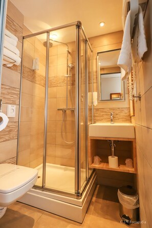 Shower, eco-friendly toiletries, hair dryer, towels