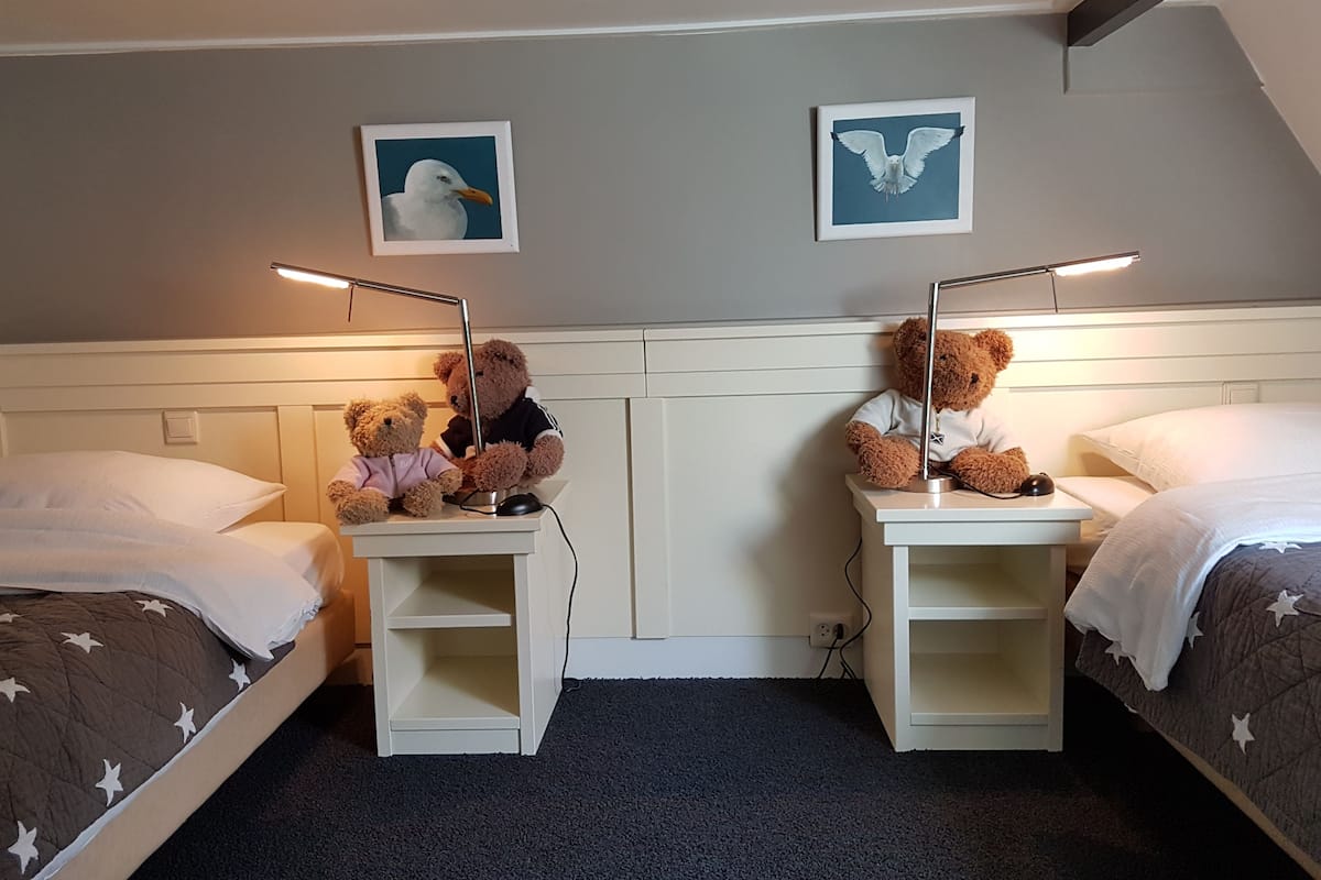 Family Room | In-room safe, desk, blackout drapes, iron/ironing board