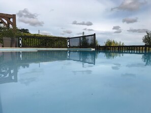 Outdoor pool, open 8:00 AM to 7:00 PM, pool loungers