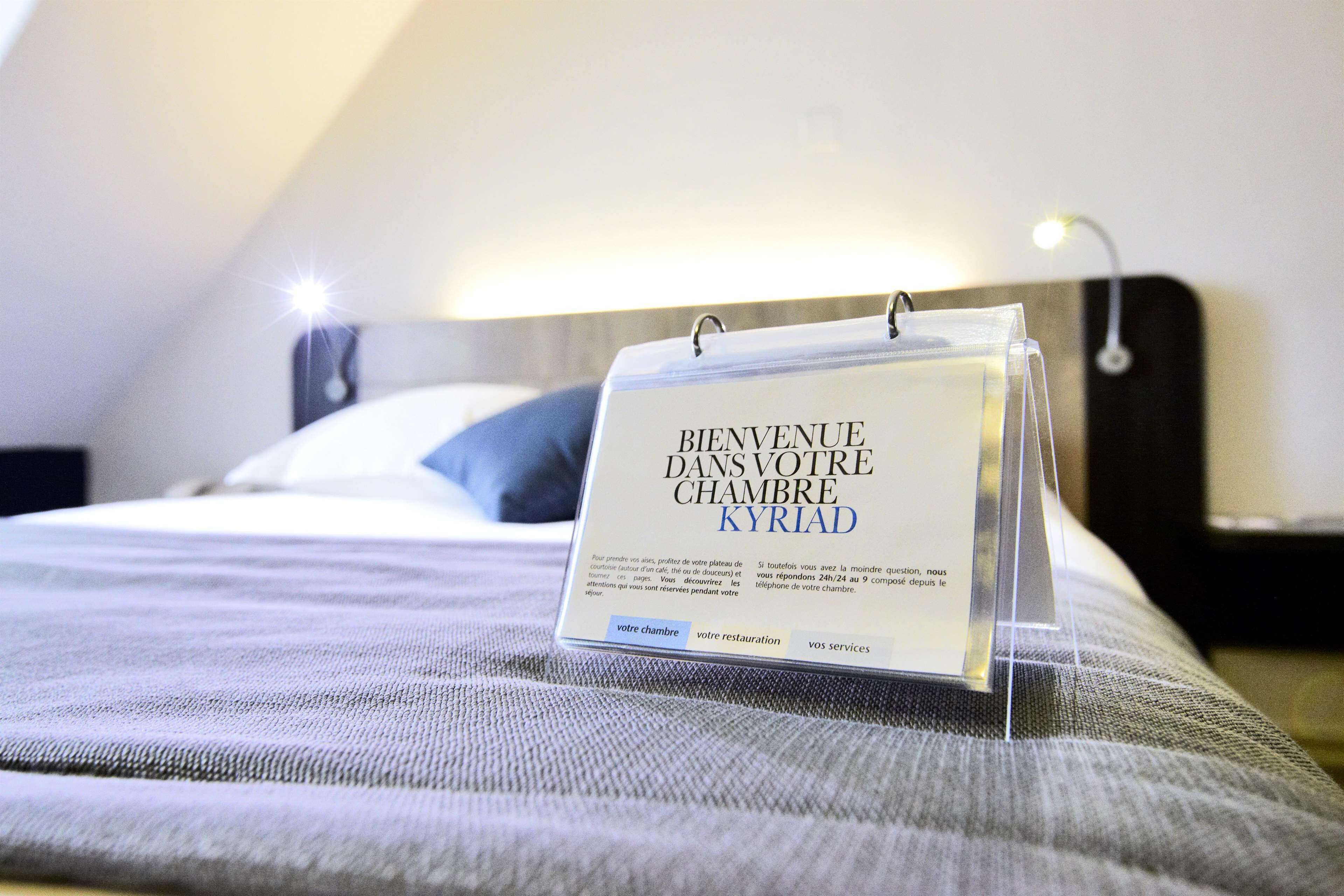 A welcome sign in a hotel room.