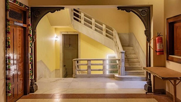A grand staircase with a marble floor leading to a conference room. - Hotel Siddhartha Palace (Ahmedabad)