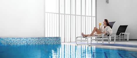 Indoor pool, open 9:00 AM to 7:00 PM, pool loungers, lifeguards on site
