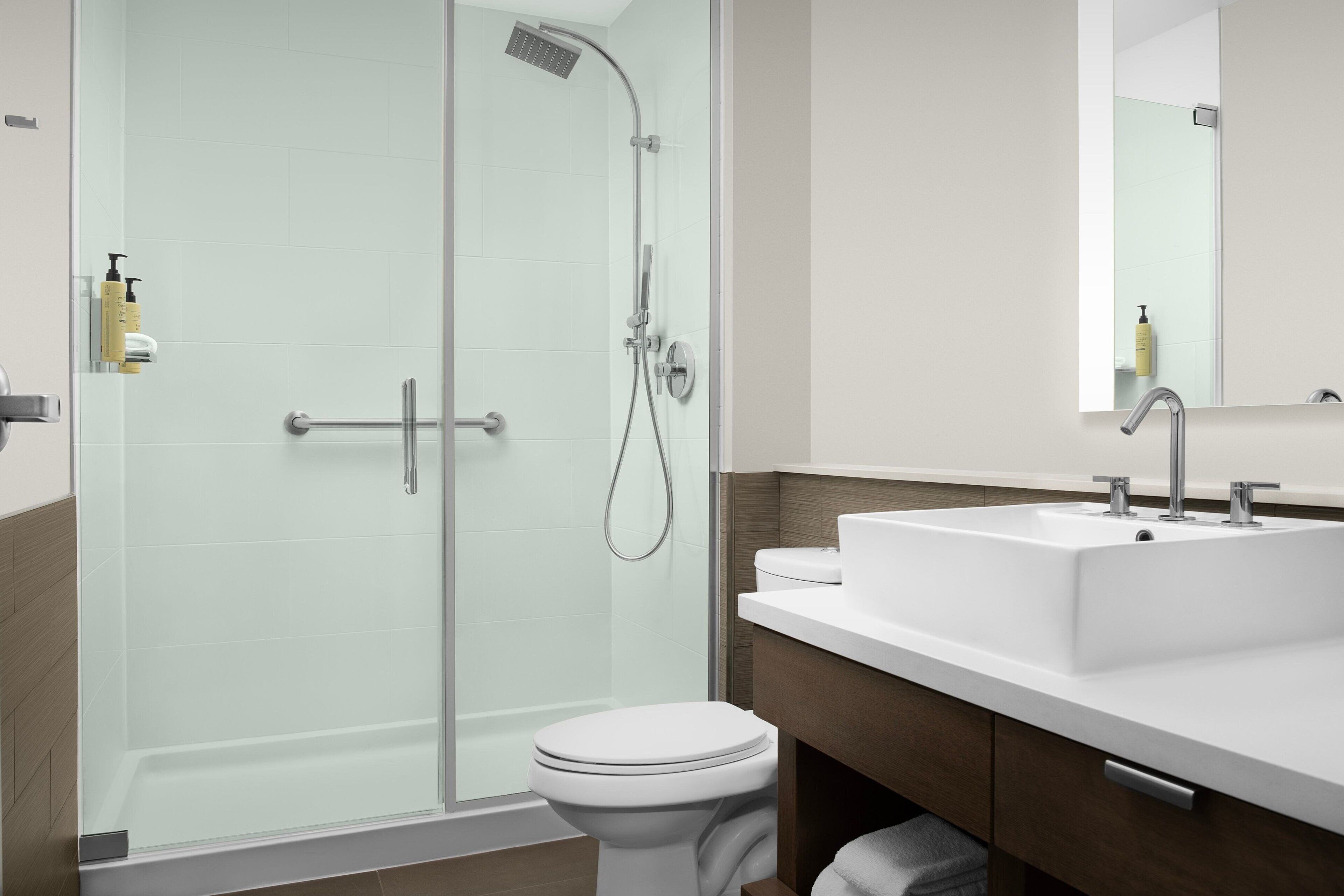 shower, designer toiletries, hair dryer, towels