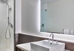 Shower, designer toiletries, hair dryer, towels