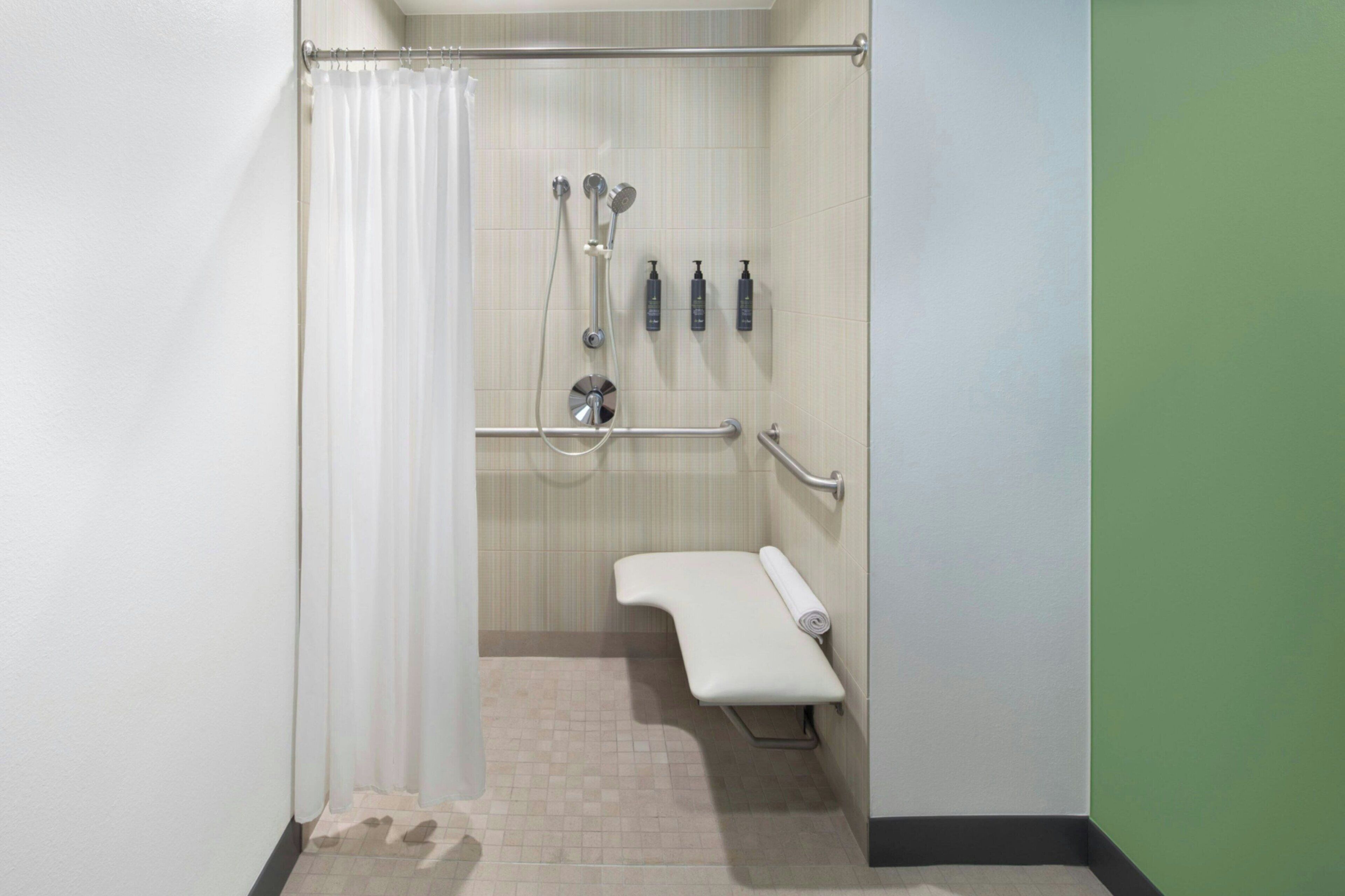 A shower area with a white curtain, a handheld showerhead, a handheld showerhead, a handheld showerhead, a handheld showerhead, a handheld showerhead, a handheld showerhead, a handheld showerhead, a handheld showerhead, a handheld showerhead, a handheld showerhead, a handheld showerhead, a handheld showerhead, a handheld showerhead, a handheld showerhead, a handheld showerhead, a handheld showerhead, a handheld showerhead, a handheld showerhead, a handheld showerhead, a handheld showerhead, a handheld showerhead, a handheld showerhead, a handheld showerhead, a handheld showerhead, a handheld showerhead, a handheld showerhead, a handheld showerhead, a handheld showerhead, a handheld showerhead, a handheld showerhead, a handheld showerhead, a handheld showerhead, a handheld showerhead, a handheld showerhead, a handheld showerhead, a handheld showerhead, a handheld showerhead, a handheld showerhead
