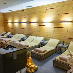 Relax in a serene spa area with reclining chairs and a tranquil ambiance.
