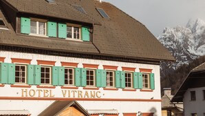 A building with a sign reading "HOTEL VITRANC" and a sloped roof with dormer windows. - Vitranc (Kranjska Gora)