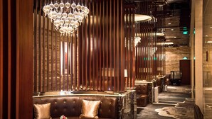 A luxurious hotel lobby with a seating area featuring plush sofas and a chandelier. - Shantou International Hotel (Shantou)