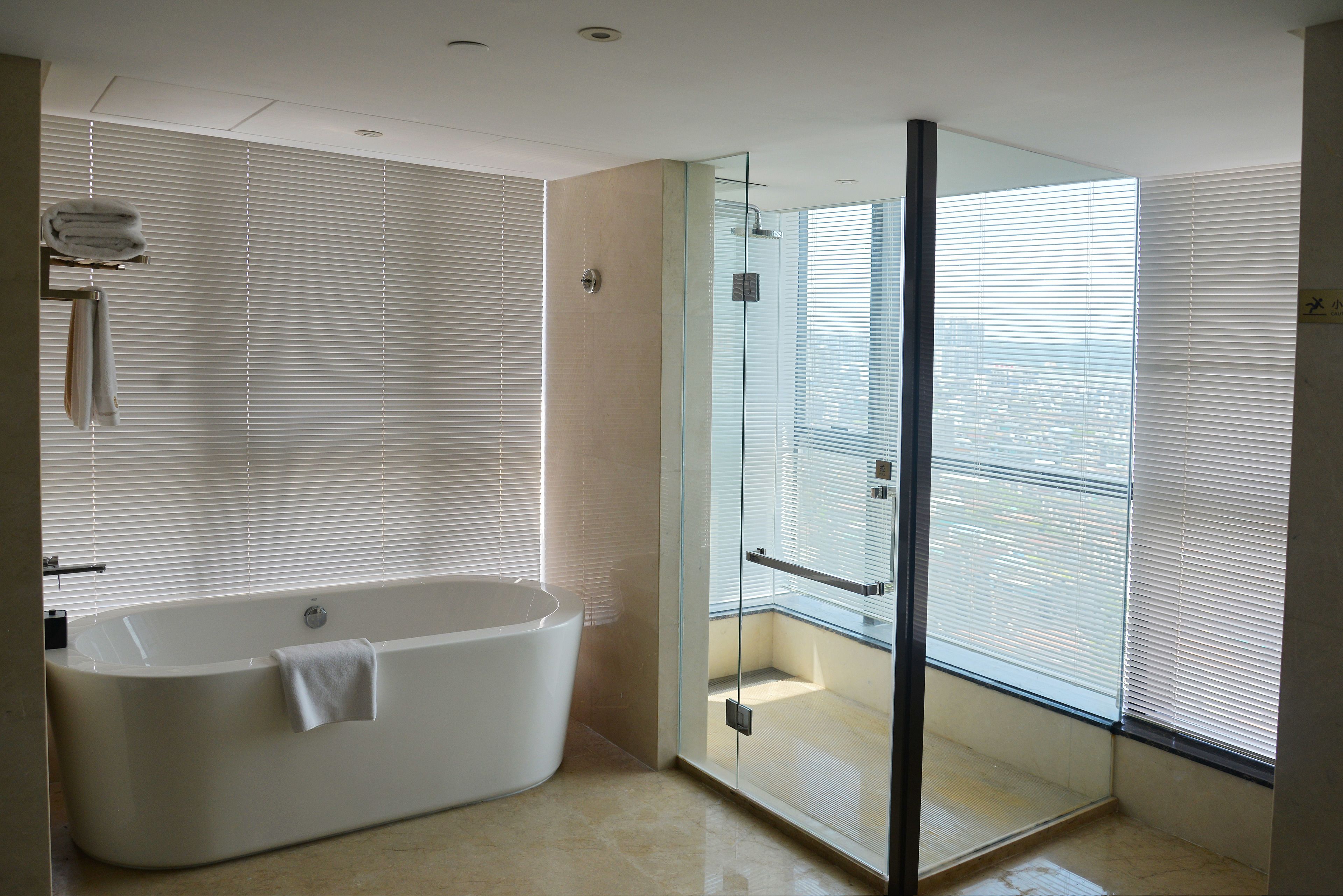 executive deluxe king room | bathroom | designer toiletries, hair dryer, slippers, towels