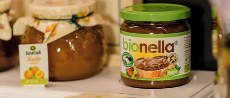 A jar of bionella vegan spread on a shelf.