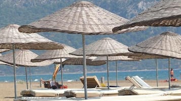 Beach shuttle, beach cabanas, sun loungers, beach umbrellas