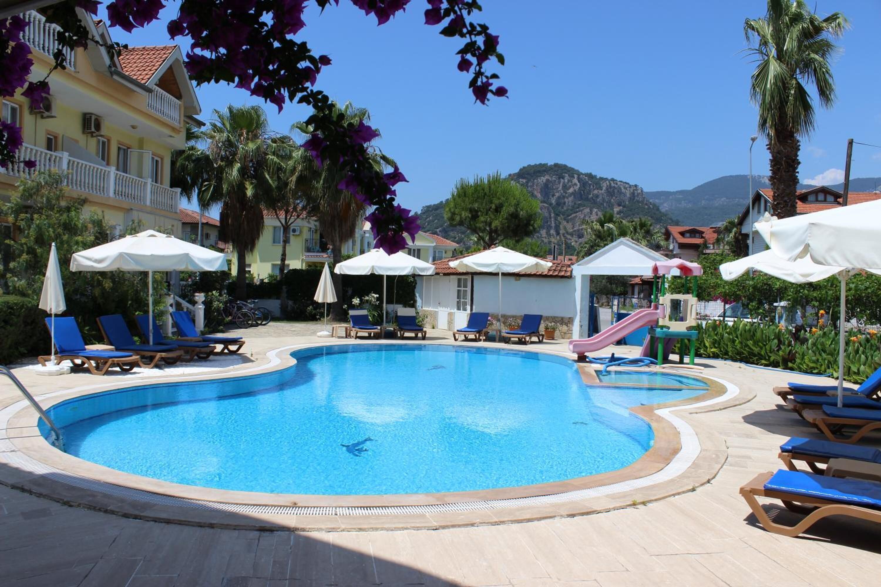 Seasonal outdoor pool, open 8:30 AM to 8:30 PM, pool umbrellas