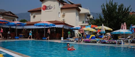 Seasonal outdoor pool, pool umbrellas, sun loungers