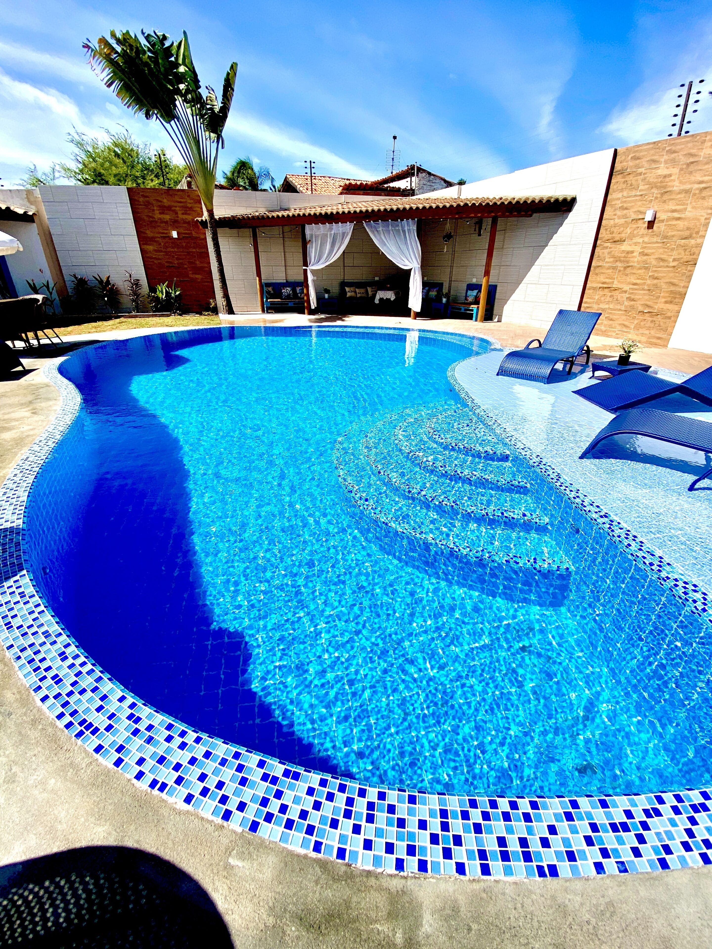 Outdoor pool, open 8:00 AM to 8:00 PM, pool umbrellas, pool loungers