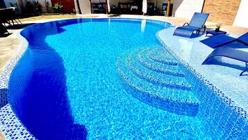 Outdoor pool, open 8:00 AM to 8:00 PM, pool umbrellas, sun loungers