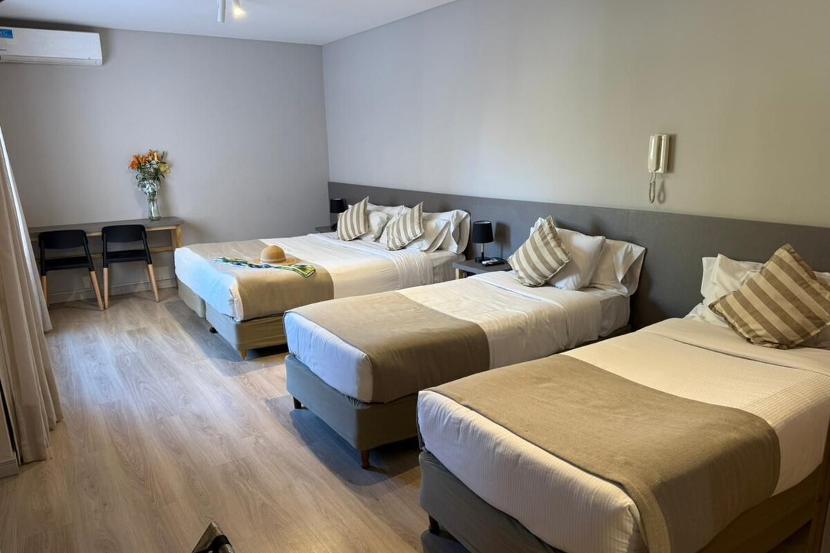 Standard Quadruple Room | Minibar, in-room safe, desk, laptop workspace