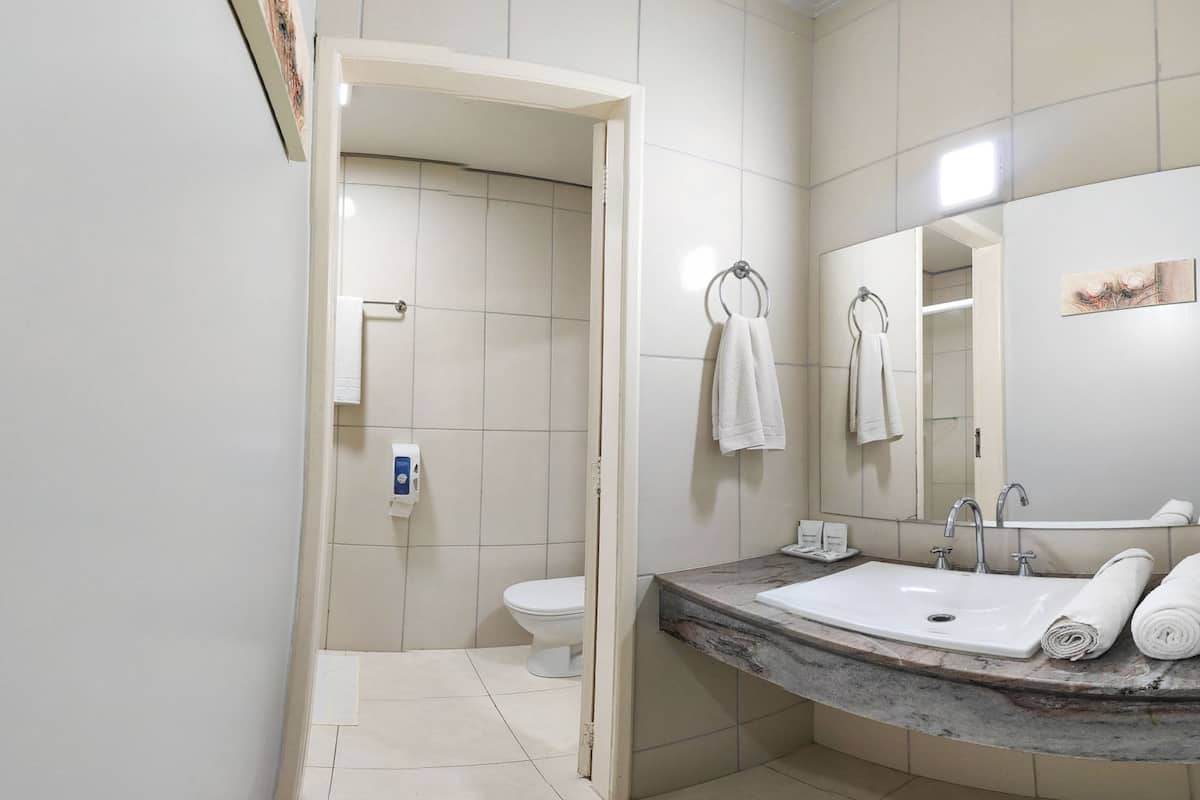 standard room, 2 double beds | bathroom | shower, free toiletries, towels