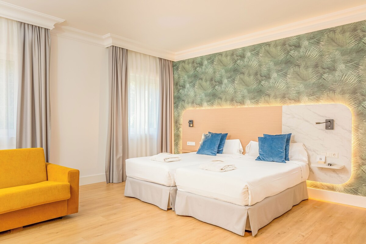 Colchones con pillow-top, minibar y caja de seguridad en la habitación 