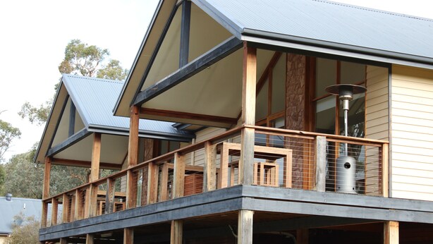 A multi-story building with a balcony and large windows. - Yering Gorge Cottages (Yering)