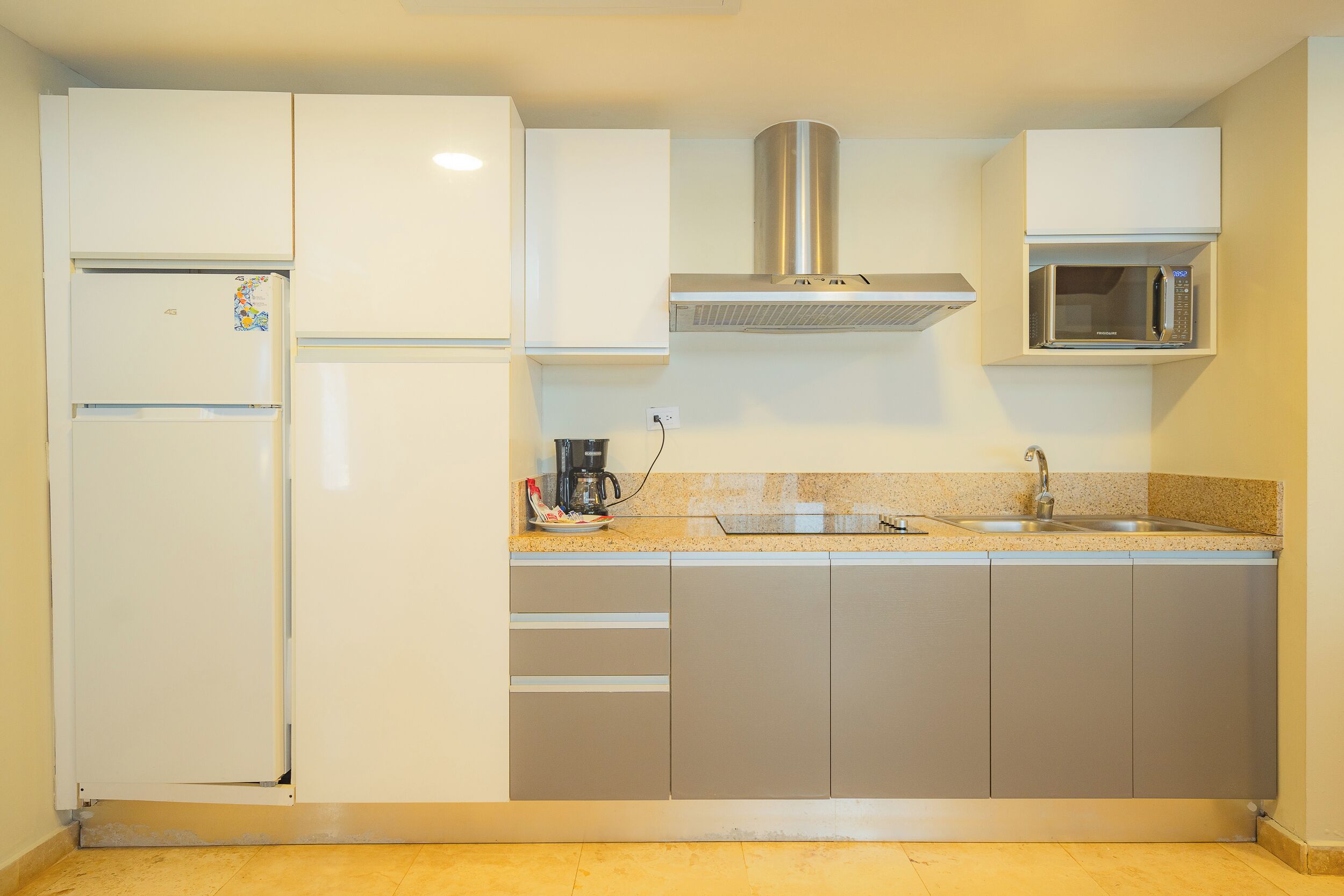 deluxe suite, 2 bedrooms | private kitchen | fridge, microwave, coffee/tea maker, dining tables