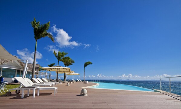 2 outdoor pools, pool umbrellas, pool loungers