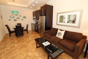 Deluxe Condo, 1 Bedroom, Balcony | Living area | LCD TV, DVD player, iPod dock