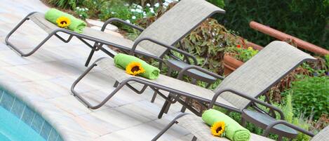 Outdoor pool, open 8:00 AM to 10:00 PM, pool umbrellas, sun loungers