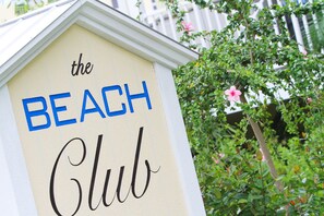A sign for 'The Beach Club' with a simple, clean design.