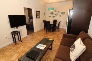 Deluxe Condo, 1 Bedroom, Balcony | Living area | LCD TV, DVD player, iPod dock