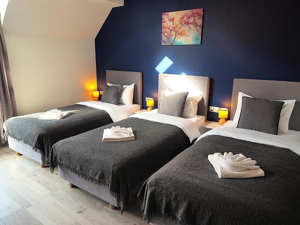 Triple Room, Garden View | Desk, laptop workspace, free WiFi, bed sheets