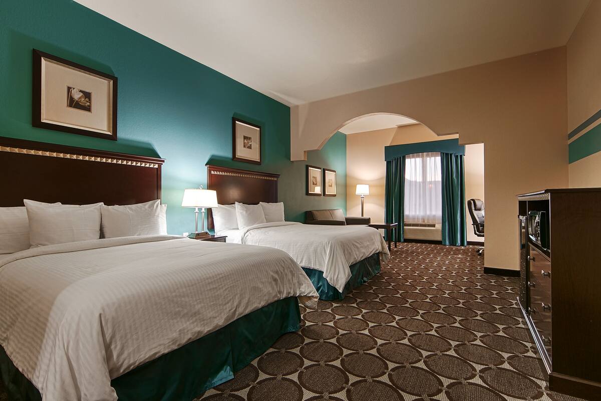 suite, 2 queen beds, non smoking, microwave (oversized room) | in-room safe, desk, laptop workspace, iron/ironing board