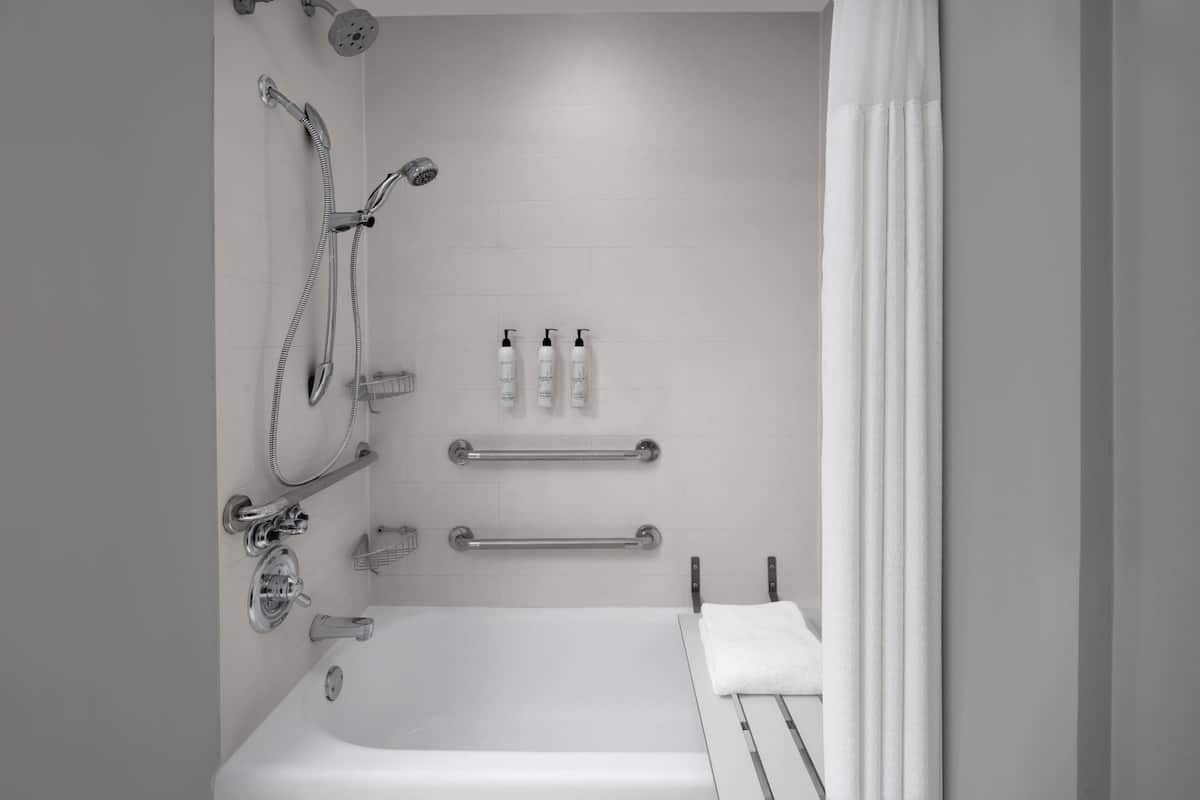 combined shower/bathtub, eco-friendly toiletries, hair dryer, towels
