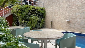 Outdoor pool, pool umbrellas, sun loungers