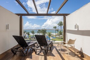 Superior Triple Room, Sea View | Minibar, in-room safe, individually decorated, desk