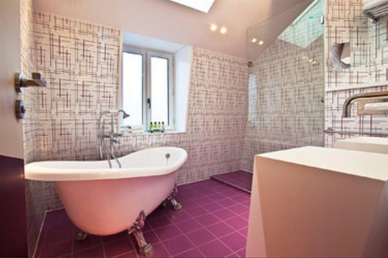 shower, designer toiletries, hair dryer, towels