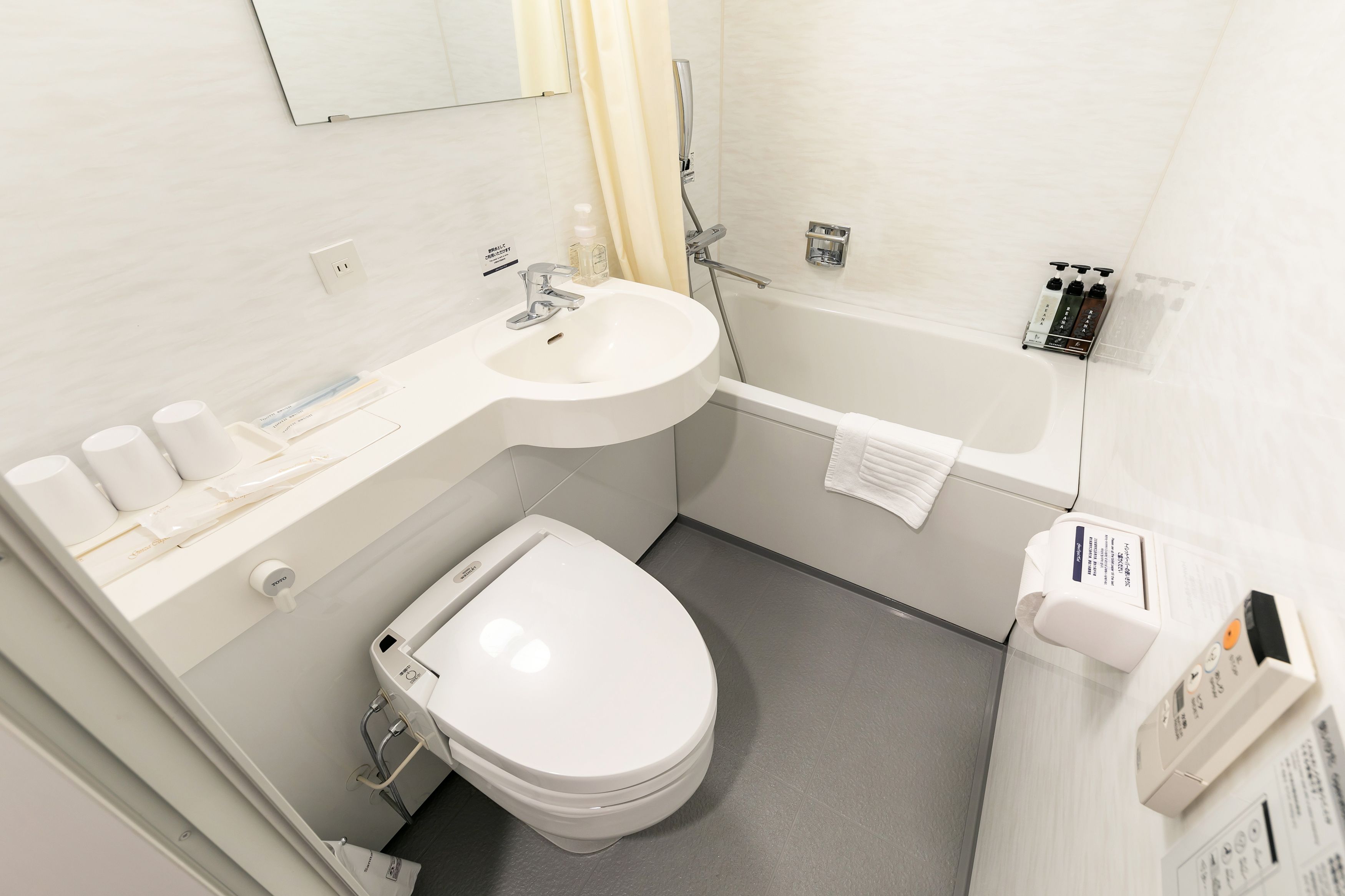 combined shower/bathtub, free toiletries, hair dryer, slippers