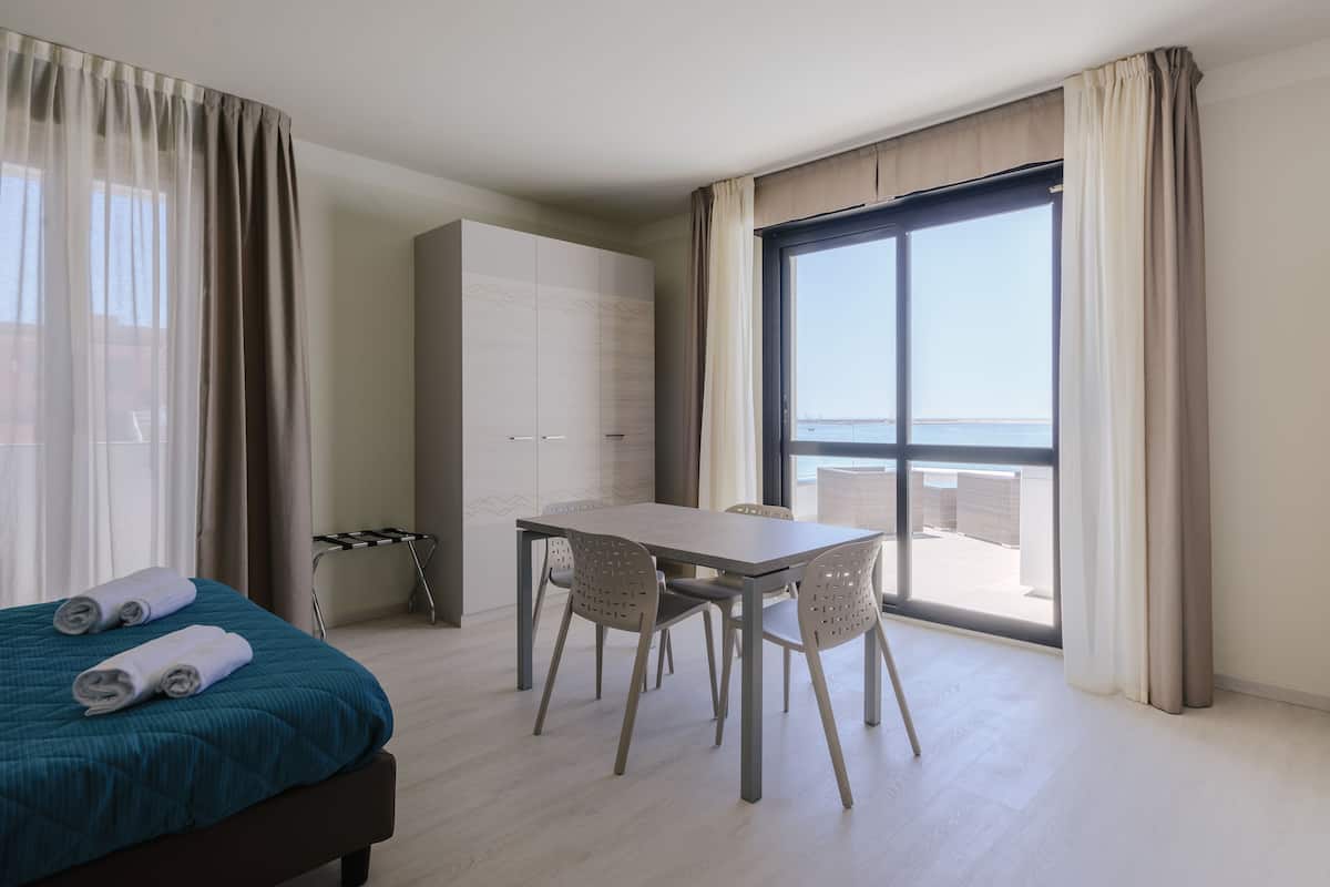 superior studio, jacuzzi in terrace, sea view | in-room safe, blackout curtains, soundproofing, iron/ironing board