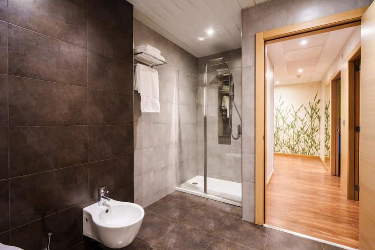 family room | bathroom | hair dryer, bidet, towels