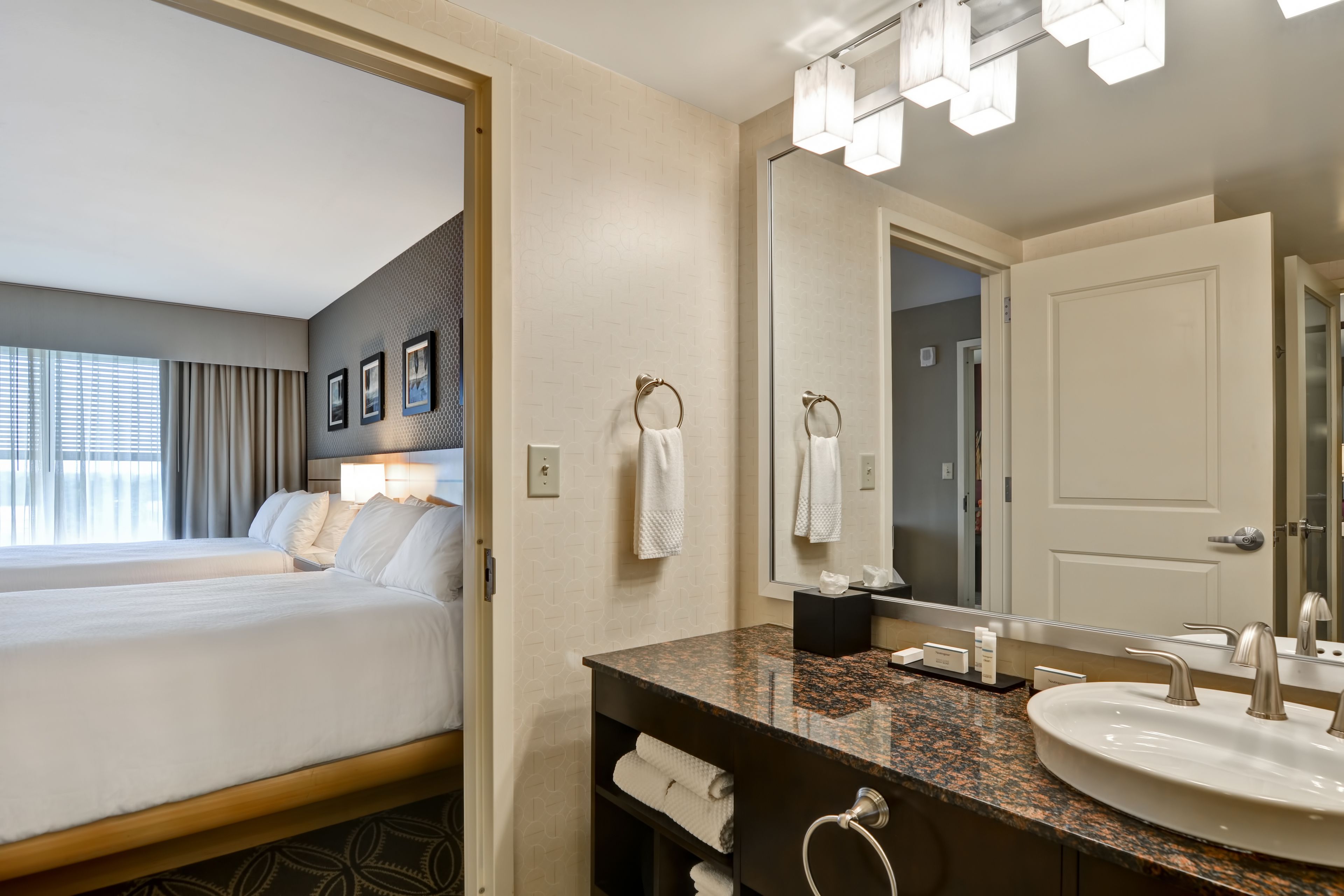 two queen extended | bathroom | shower, free toiletries, hair dryer, towels