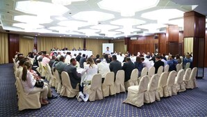 A conference room with rows of chairs and a stage for presentations. - Hotel Diplomat (Tunis)