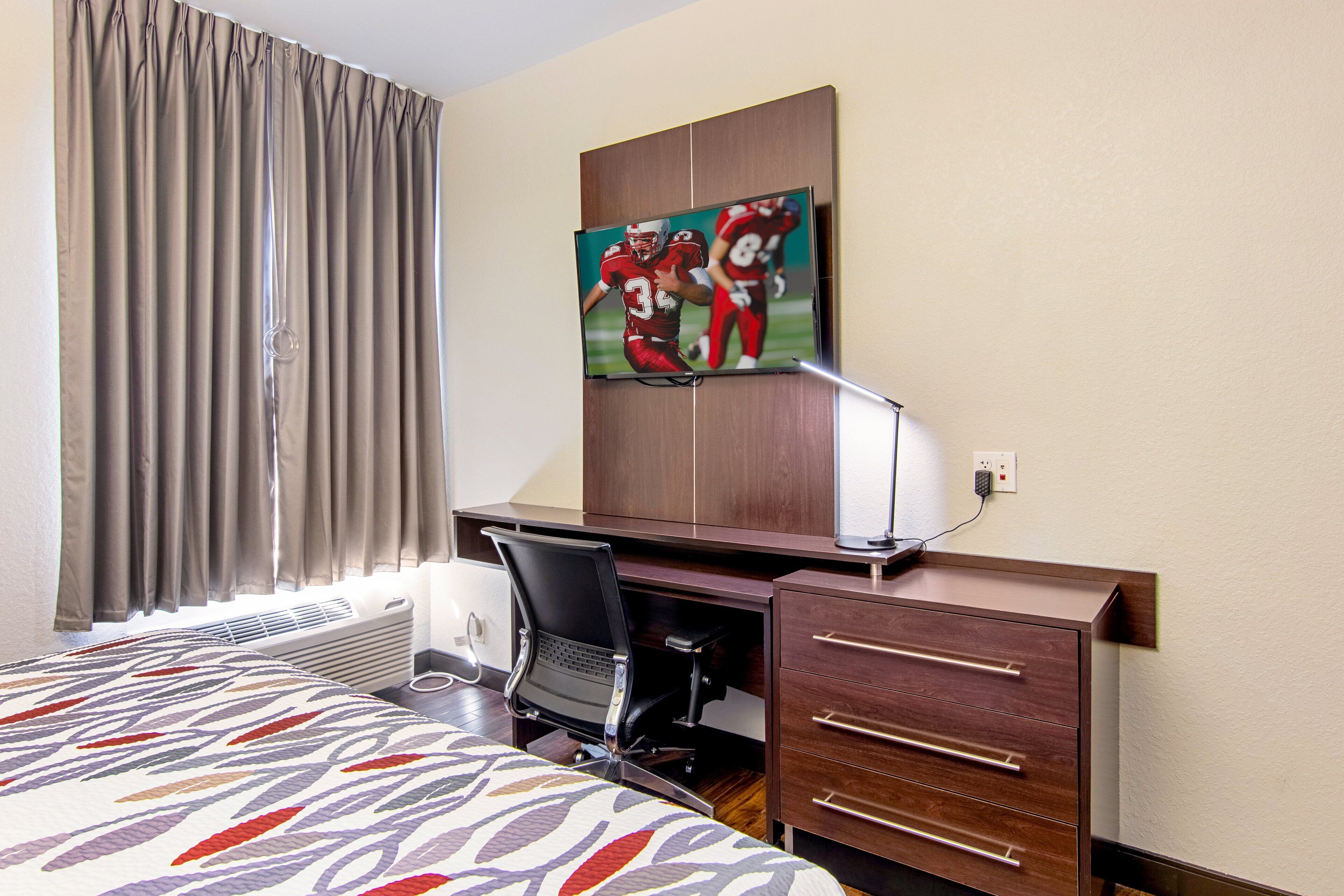 premium bedding, pillow-top beds, desk, blackout curtains